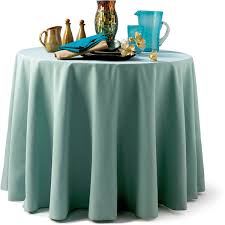 Seamist colored table linens on a round table 