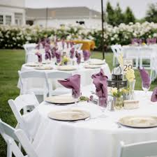 Outdoor wedding reception with white poly premier table linens