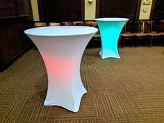 Two fitted Spandex cocktail covers in white at a Birthday party