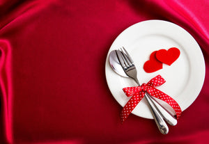 Holiday Red table linens up close with a plate and Valentine's Day decor