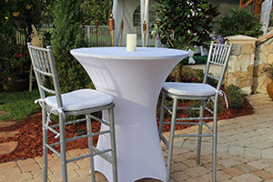 Fitted spandex table linen in an outdoor setting with banquet chairs
