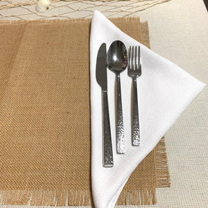 Burlap placemat with fringe and white napkin