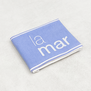Close-up of a white napkin with 2 color print for La Mar Restaurant