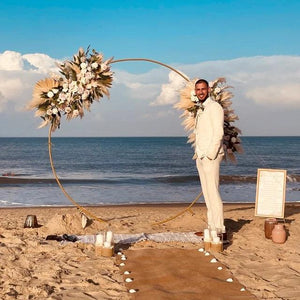 burlap aisle runner at a beach wedding  with groom standing by