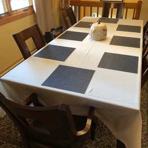 Rectangular Dinner linens with placemats on a home table