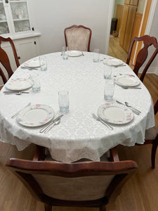 Damask tablecloth on an oval table