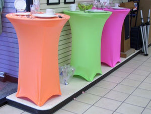 Spandex table covers in 3 colors at a wedding rental store