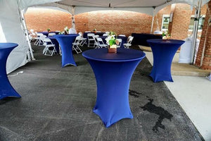 Spandex-fitted table covers in Navy blue set up for an outdoor reception under a tent 