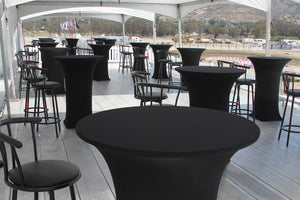 Black fitted Spandex tablecloths in an outdoor deck restaurant with high-rise chairs