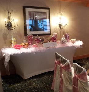 White Spandex table linen on a candy station