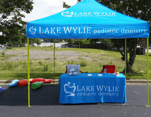 4-foot Blue printed tablecloth for Lake Wylie Dentistry with matching tent