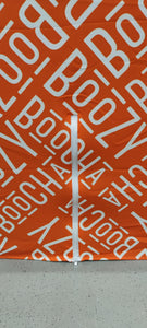 Close up shot of the zipper option on a Spandex orange and white custom printed table cover