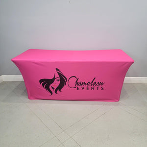 Pink spandex table cover with black logo for chameleon events