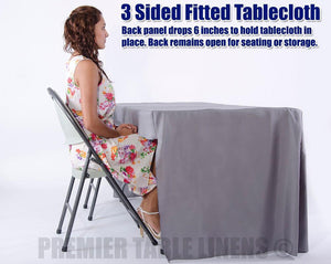 8' Image of a 3 sided 8 foot custom printed table cloth with someone sitting on the open backside
