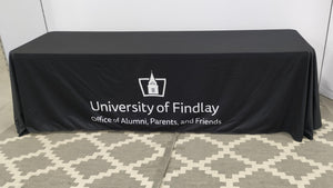 Black custom branded tablecloth with a white University logo 