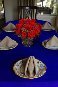 Havana Napkins in natural on a table with blue Havana table linens and roses 