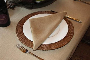 Havana Faux burlap napkin on a plate with a placemat under and a wine bottle next to it