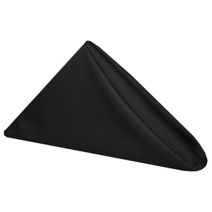 Black napkin folded into an upright 3 point shape
