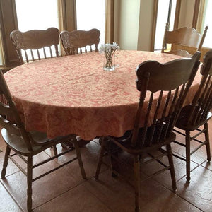 Vintage tablecloth on an oval table 