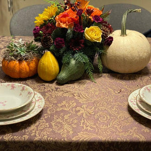 Damask table linen set for the fall with pumpkin and other fall decorations 
