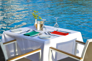 White restaurant tablecloth overlooking lake