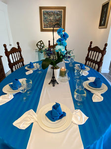 Large oval tablecloth with a table runner and cloth napkins