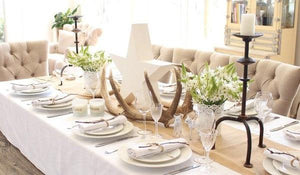 White Cotton linens with a natural runner on an elegant Sunday brunch table with a star centerpiece