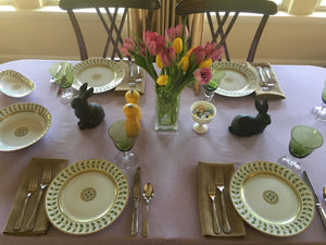 Pink formal linens with natural colored napkins on the table in an Easter holiday celebration