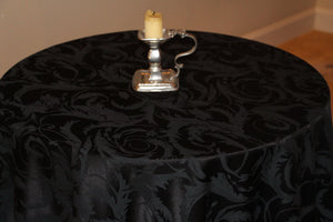 Black damask tablecloth on a round table