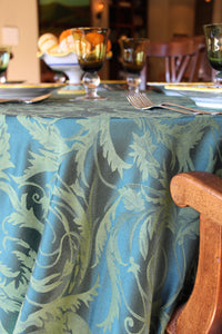 round melrose damask tablecloth in a dining room.