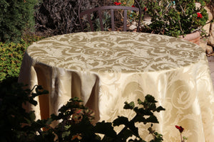 Round Melrose damask tablecloth outdoors in a beautiful garden