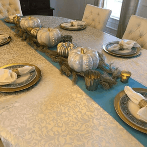 Somerset Damask Oval Tablecloth on a large table