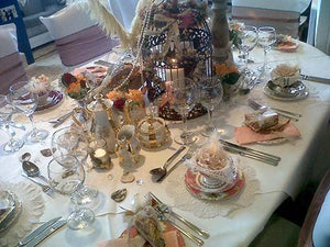 Elegant linens on a Birthday celebration table with elaborate decorations