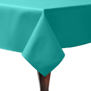 A formal teal-colored tablecloth on a square table