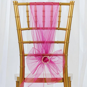 Pink organza poly chair sash on a gold banquet chair 