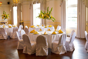 Round Poly premier wedding linens with yellow napkins