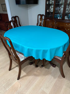 blue oval tableclothon a small oval table
