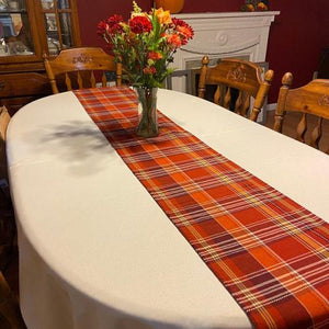 White oval tablecloth and table runner
