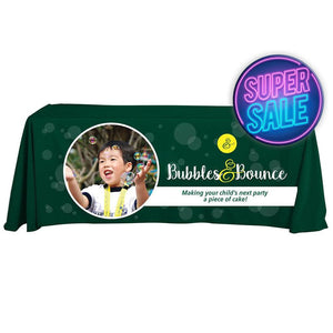 Custom branded green 6-foot tablecloth with full-color print for Bubbles & Bounce with sale graphic