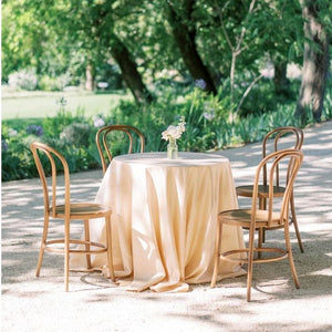 Classy outdoor Duchess linens on a round lunch table