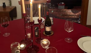 120 Round Tablecloth on dinner table with wine bottles, glasses and candles