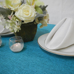 Blue linen tablecloth and cotton napkins on an elengant tablescape