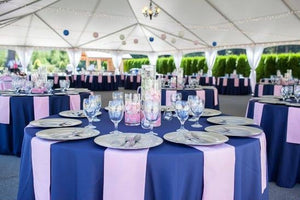 Large blue round tables with Blue Havana tablecloths and white napkins