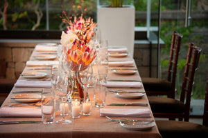 Elegant Havana linens on a large oblong table with white napkins