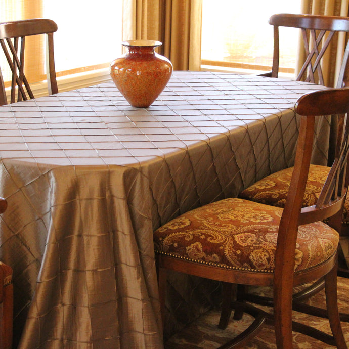 Burnt orange Bombay Linens at a home dining room table