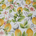 Oilcloth tablecloth with lemons, leaves, and flowers on a high quality, glossy oilcloth.
