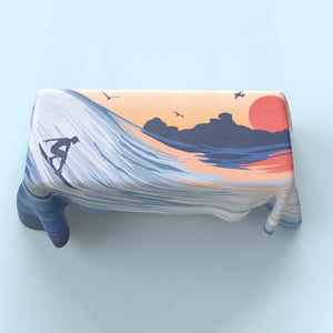 Custom printed table cover shot from above with surfing art all around it