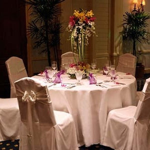 120 Round Tablecloth with matching chair sashes in an intimate reception