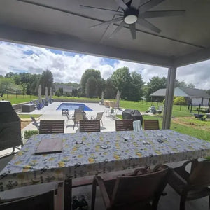 Oilcloth tablecloth with bright lemons and vines print on the waterproof tablecloth.