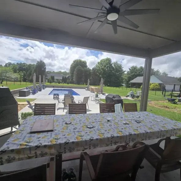 Oilcloth tablecloth with bright lemons and vines print on the waterproof tablecloth.